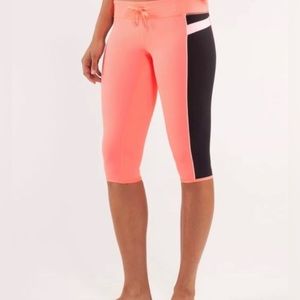 Lululemon Heat It Up Cropped coral pop/black leggings w/drawstring EUC